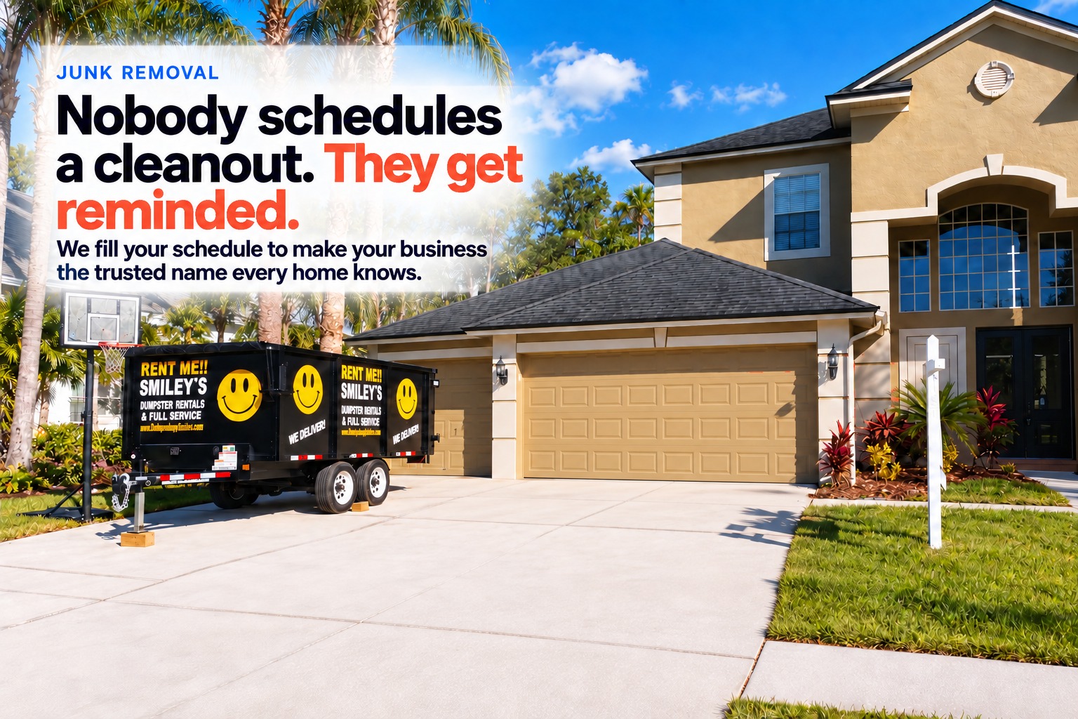 A junk removal trailer parked in a driveway